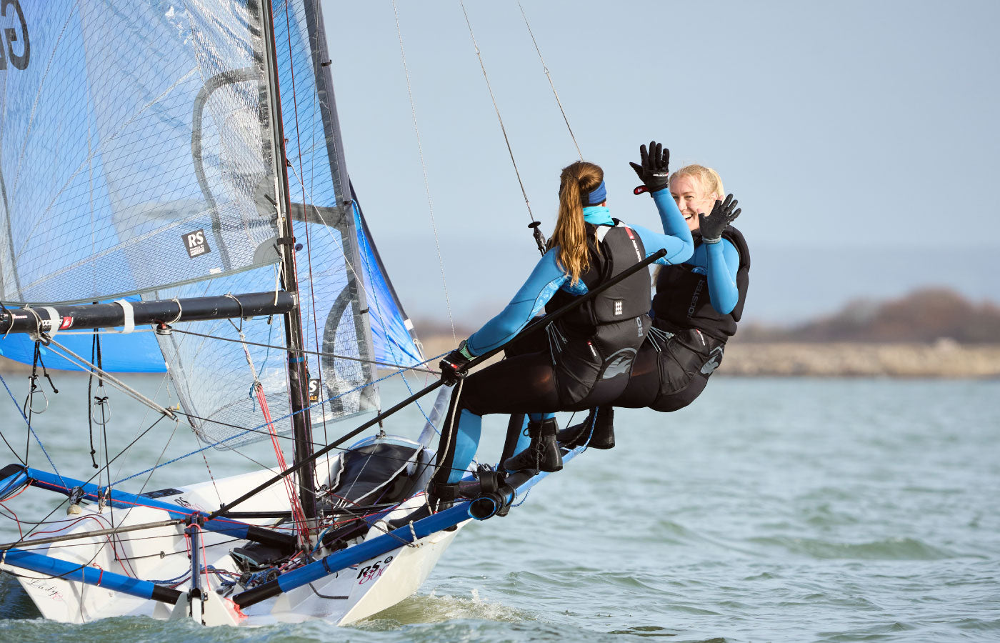 two women sailing and high fiveng in supertherm 4mm seagrass