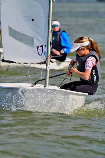 young sailor oppi wearing rooster race bib